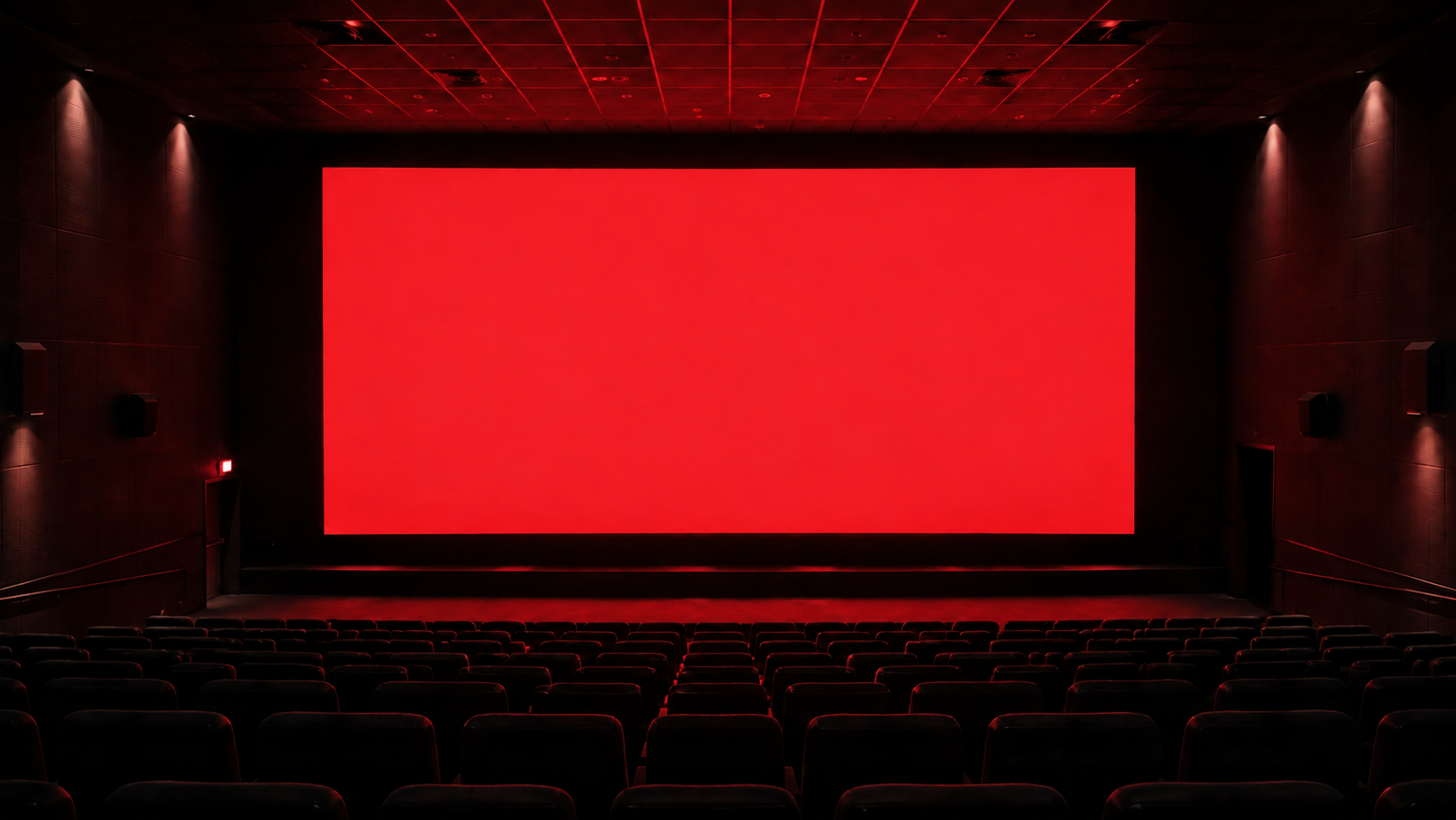 Conceptual empty cinema with a luminous red screen